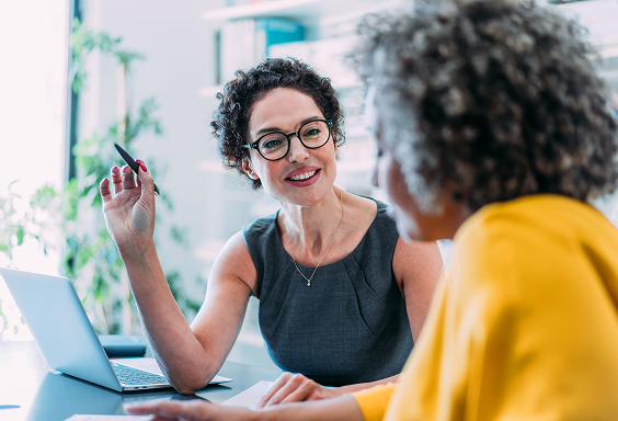 Broker smiling and talking to client