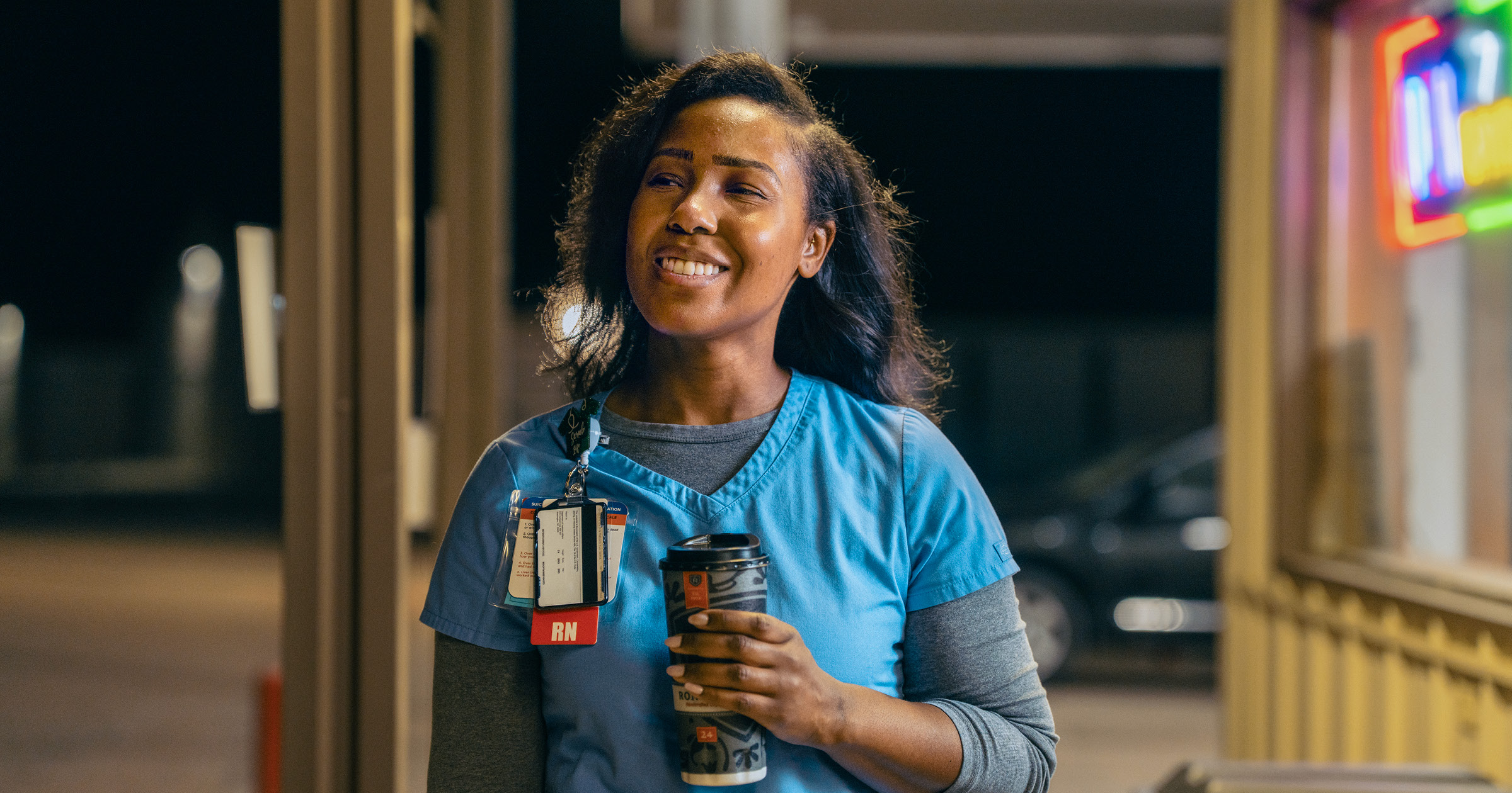 a nurse enjoys a coffee after her shift